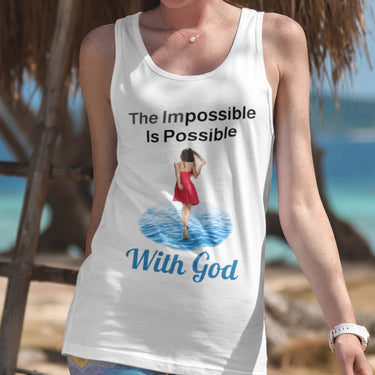 Lightweight Bella+Canvas tank top made from preshrunk cotton with “Impossible Woman” design message, “The Impossible Is Possible with God,” inspirational apparel encouraging women to walk in step with God who makes our impossible dreams become real, woman in white tank top